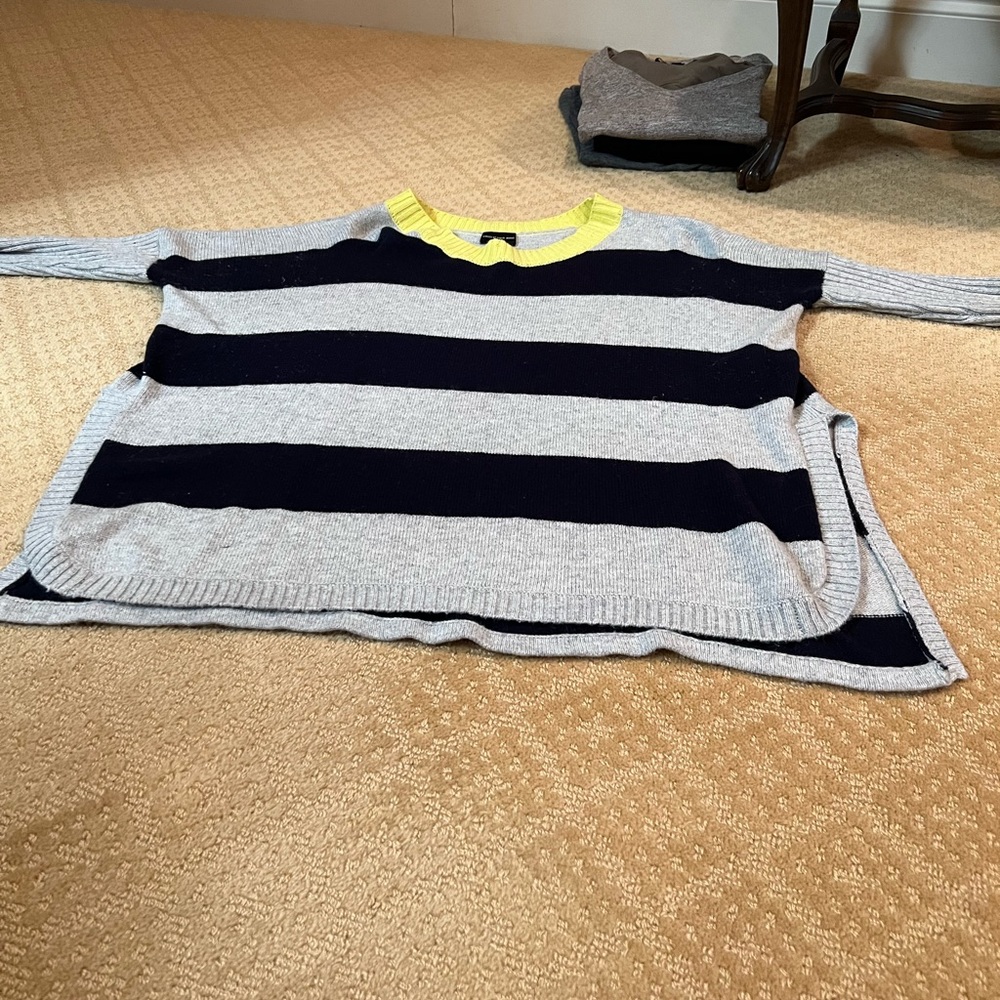 Central Park West light sweater.  It’s an XS, but it fits much bigger